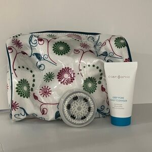 Clarisonic brush head, cleanser and makeup bag